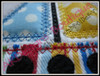 Close-up example of the Diamond Stitch Sailboat with fabric.
Madeira Thread Colors Used:
#1683 Yellow
#1747 Red
#1775 Blue
#1800 Black