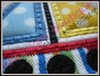 Close-up example of the Satin Stitch Sailboat with fabric.
Madeira Thread Colors Used:
#1683 Yellow
#1747 Red
#1775 Blue
#1800 Black