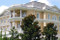 Gables adorned with architectural applique CRA17.  Acanthus Leaf themed cast plaster shield