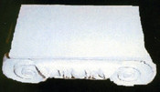 This cast capital had decorative details and large volutes