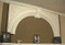 A plaster arched overmantel featuring Acanthus Leaves and Egg and Dart molding