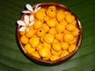 Yellow painted kukui nuts