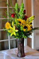 The sunny day bouquet is a perfectly cheerful bouquet made up of Bright yellow lilies and SUNflowers, red roses, and  beautiful tall and slender bells of Ireland. Perferct for Mothers Day, sending Birthday wishes or a Get Well.
