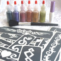 click here to add a descriptionTribal Glitter Tattoo Kit contains:-
1 x Pros-ade Glue 8 ml in an applicator bottle
6 x Glitter Puffers- Black, Purple, Red, Tangerine,Gold &Emerald Green
25 x Tribal Stencils
1 x Sweeper Brush
Easy to follow Instructions
All in an attractive storage box
