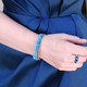 Stretch Ring shown in Sterling Silver Montana. Shown with Swarovski Crystal Stretch Bracelets in Aquamarine, Blue Zircon, and Montana.
