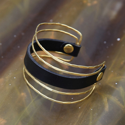 Unique brass cuff with chocolate brown leather detail Unique brass cuff with chocolate brown leather detail
