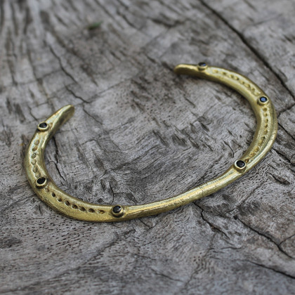 adjustable brass bracelet with black stone detail adjustable brass bracelet with black stone detail