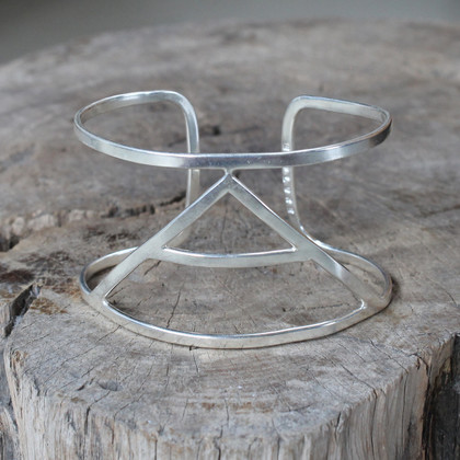 silver statement cuff featuring Explore glyph symbol silver statement cuff featuring Explore glyph symbol