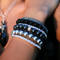 Swarovski Crystal Stretch Bracelets shown in (top to bottom) Black Diamond, Crystal (Clear), Jet (Black) & Crystal (Clear). Shown with Pearl Stretch Bracelets in (top to bottom) Mystic Black, Dark Gray & Light Gray & Navette Cluster Necklace in Black Tie.