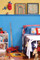 A boy's bedroom featuring beaded birch paneling, painted blue