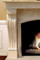 Detail of the scrolling travertina stone mantel leg