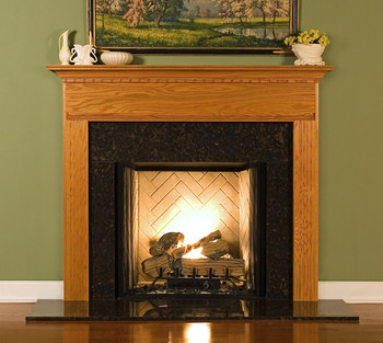 The Sterling fireplace mantel has fluted legs and dentil on breast plate.