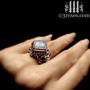 raven-love-engagement-ring-silver-magic-moonstone-hand-model-300.jpg