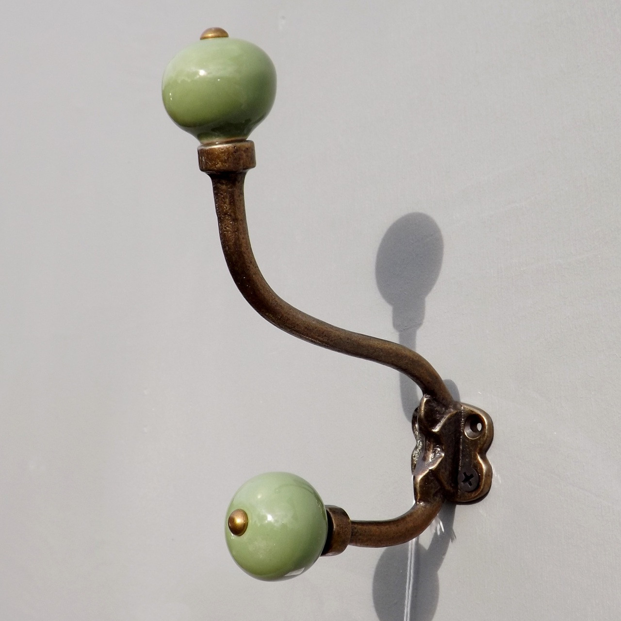 lovehooks.co.uk antique brass effect double coat hook with ceramic knobs