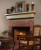 Marble facing shown with a wood mantel shelf.