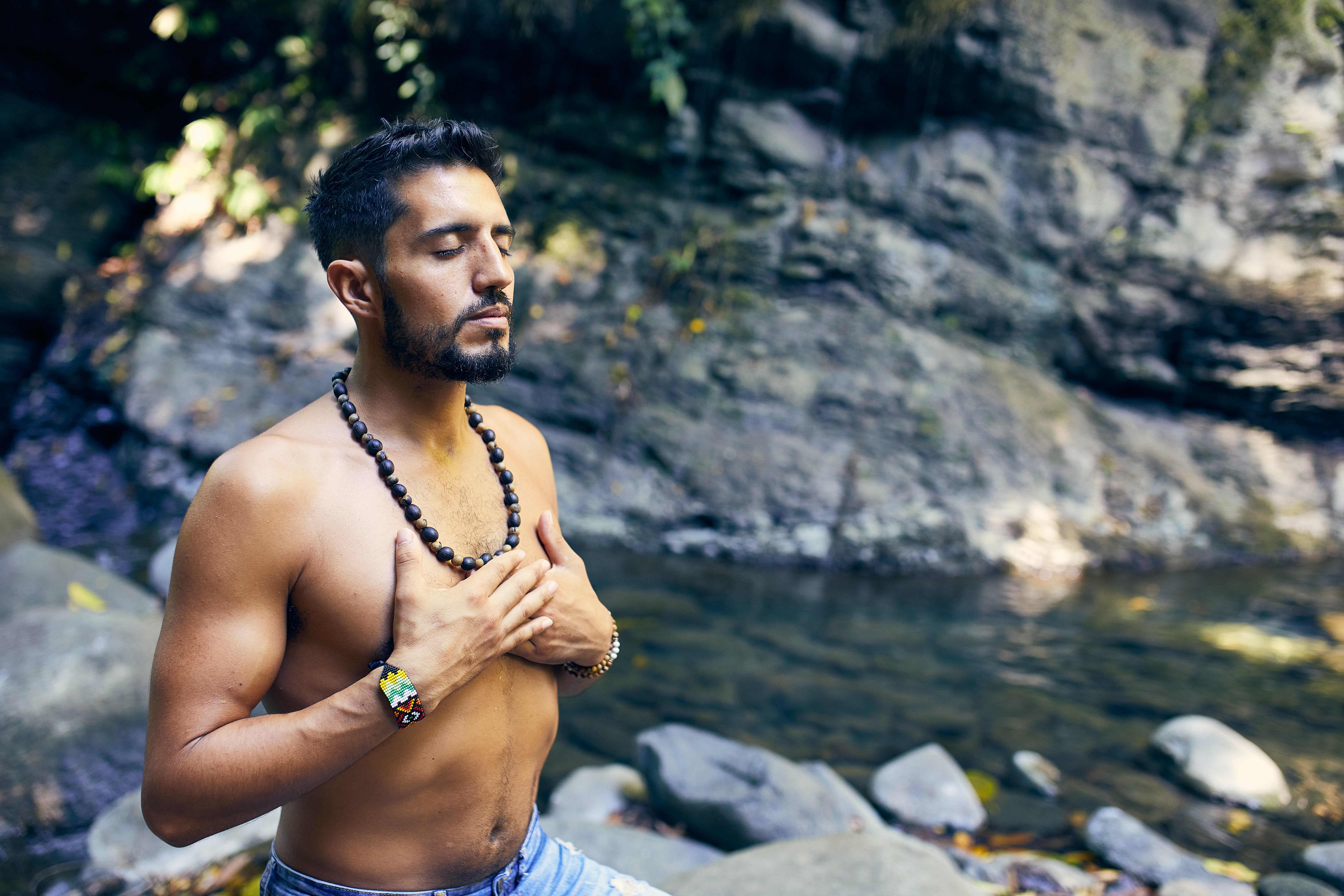 A man embraces his 4th chakra energy center