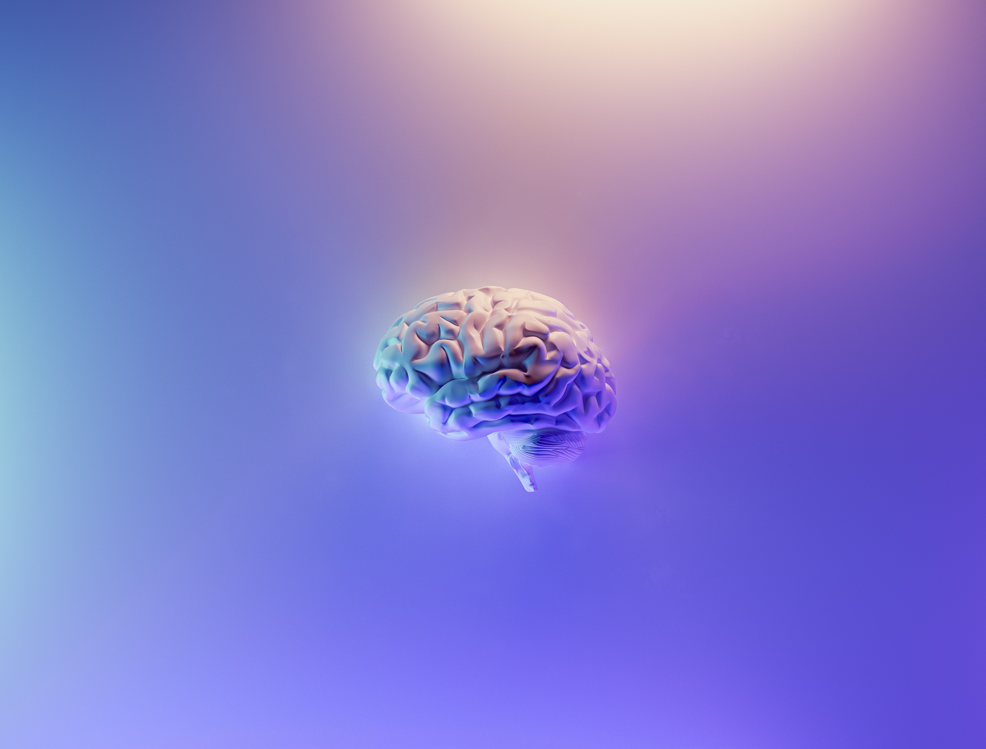 A brain floats in the center of an abstract-colored background.