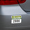 Image shows a numbered parking permit on the rear bumper of a car.