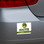 Image shows a parking permit displayed on rear bumper of car.