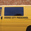 Shown are black letters on the side of a preschool van.