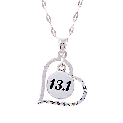 13.1 round charm inside a heart hanging on from a star chain.