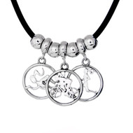 3 circle cutout charms on a black cord necklace with sterling silver spacer beads. Each charm is on a dainty charm carrier.