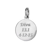 Round silver charm with custom engraved information.