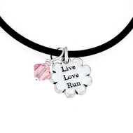 Black cord necklace with Live Love Run mini charm and pink Swarovski crystal.