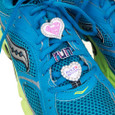 shoelace charms on running shoes.