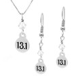 13.1 mini charm and crystal necklace and earring sets.