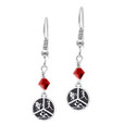 Round Triathlon earrings with red crystal.