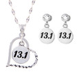 13.1 charm in a heart on chain with 13.1 round earrings on cubic zirconia posts.