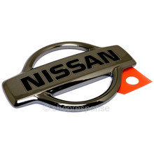 OEM / JDM Nissan 98-00 Skyline R34 Rear "NISSAN" Emblem - Black Chrome (84890-AA000)