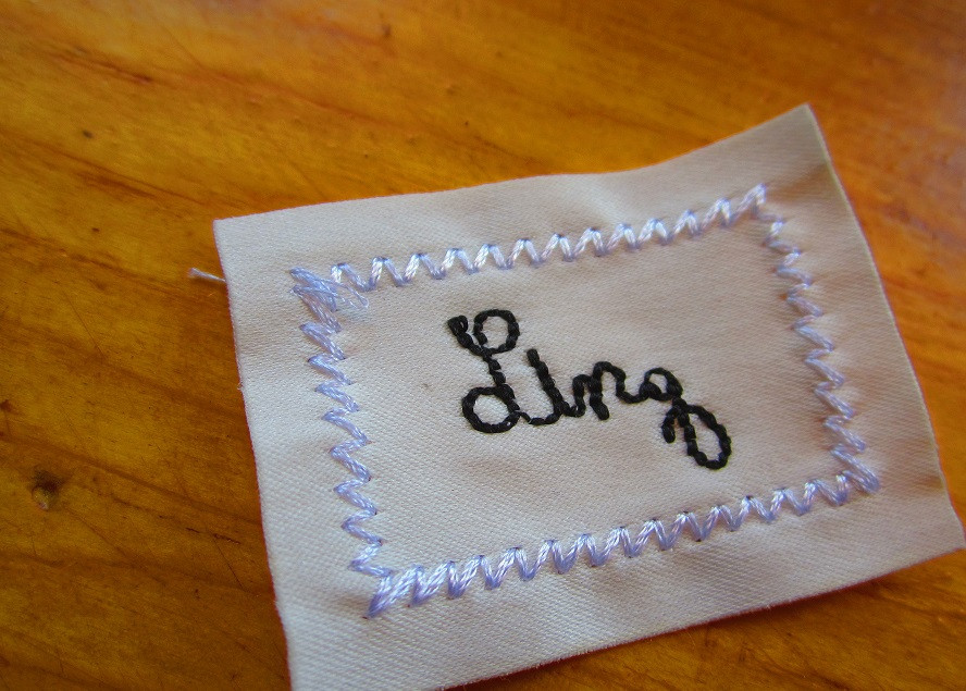 embroidered satin cotton clothing label