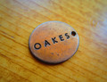 Distressed antique copper metal clothing label
