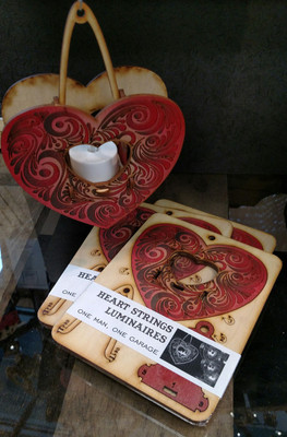 Heartstrings, hanging tealight luminaries kit. Painted wood model kit you punch out and snap together!