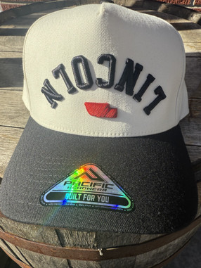 Pacific Brand hat.  Structured front, slightly stretchy panels, snap enclosure.  All the rage with the hip kids.