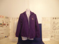 Shown here in a womens 8 oz. 50/50 cotton-blend purple with a gold/blue service mark.