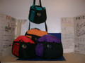 Shown here embroidered with exotic new turquoise/black, with Royal blue as the new available substitute & equally as nice, featured to tempt us all! New duel-colored duffel are here! Equipped with a full zipper closure, over-the-shoulder strap, hand straps, and a much needed extra front pocket. Medium sized at 18" L X 10" W and carries enough room for up to men's sneaker sizes with room left for shirts, towels, and plenty of miscellaneous. Now this is compact luxury for all your small on-the-go leisure travel needs. Product note: Vinyl heat transfer option is similar to screen-printing with the same great aesthetic and durability just a slightly different process.