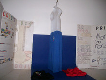 Shown here in youth 9" medium 100% polyester sport royal blue. Mannequin is shown from the side in blue and from a back view in X Small 100% polyester 9" black to show the rear location of the service mark. It's (sm) also conveniently located higher up for everyday wear-ability with your shirt tail in or out. All youth shorts are pocket-less with a draw cord for now with a tight elastic waist according to online manufacturers specs. We went with it for now because the quality is premium & will improve as more becomes available. We also squeezed out more colors than there should be... and found XSmall!