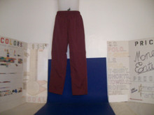 Shown here from a front view are premium 100% polyester moisture-wicking small maroon American Fantasy windpants with side pockets, rear right pocket, drawcords, and zipper-cuffs standard.