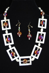 Full view of necklace set on dark background