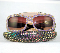 Lilac sunglasses in multi-colored case available on site.