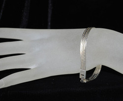 Back view showing clasp on hand model
