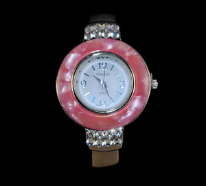 Full face view of pink bangle watch