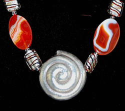 Close up view of Snail silver pendant