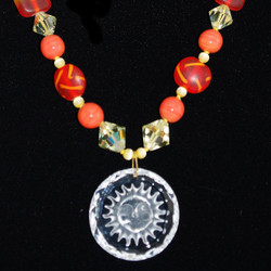 Close up detail of beads & Pendant. Sun has a smiling face.