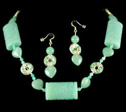 Full view of necklace set against black background