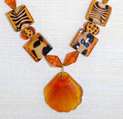 Detailed view of beads and glass pendant