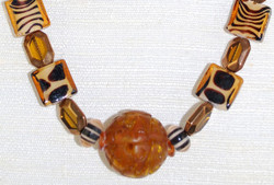 Lower portion view of beads and Carved Amber Pendant